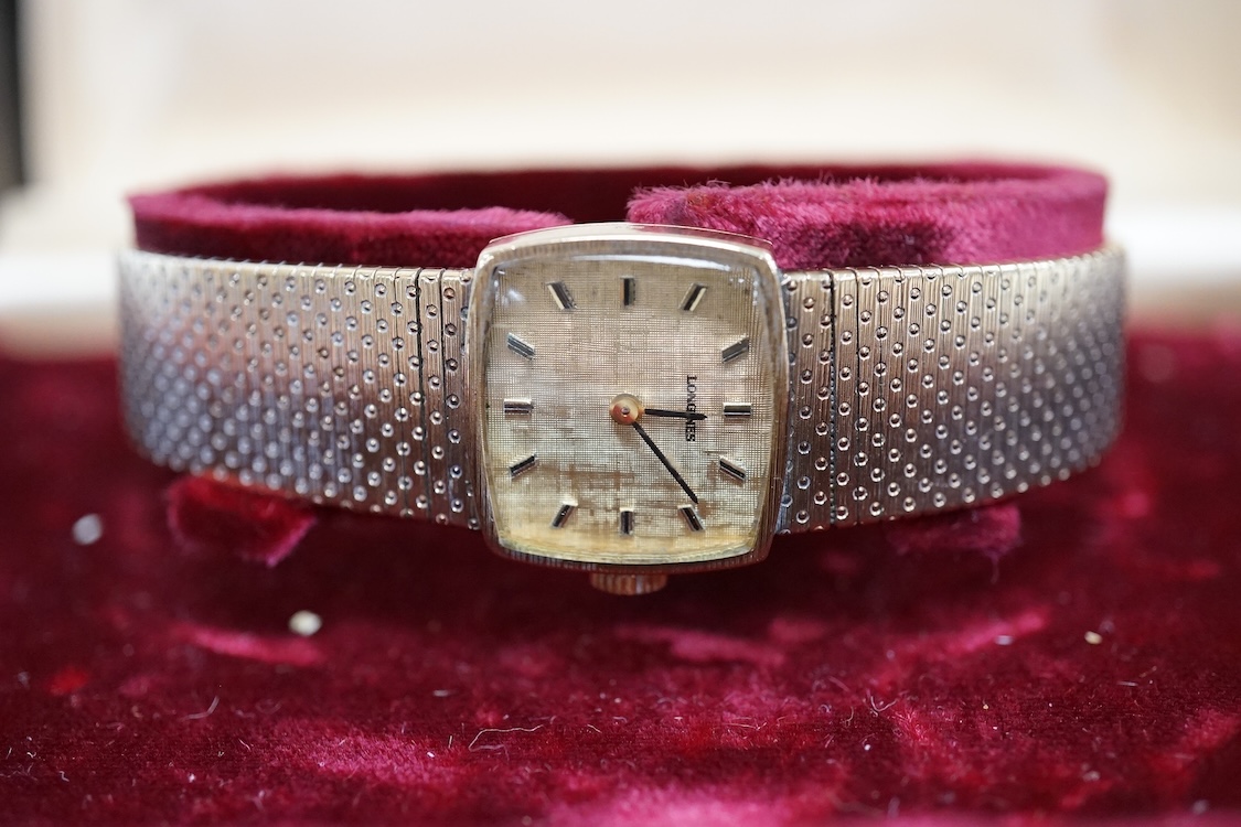 A lady's early 1970's 9ct gold Longines manual wind wrist watch, on an associated 9ct gold bracelet, gross weight 38 grams, with Longines box and pamphlet.